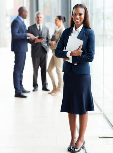 23152793 - beautiful african businesswoman standing in modern office 23152793 - beautiful african businesswoman standing in modern office